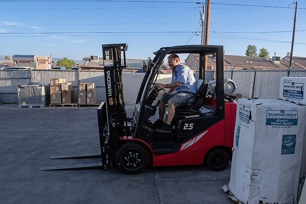 tech driving forklift