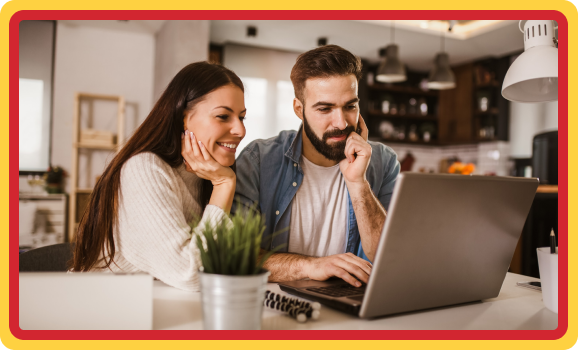 couple looking at laptop for maintenance plans