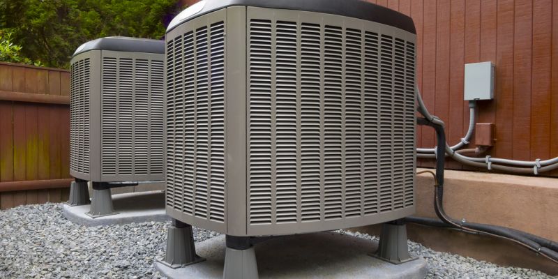 Two HVAC units outside of a home